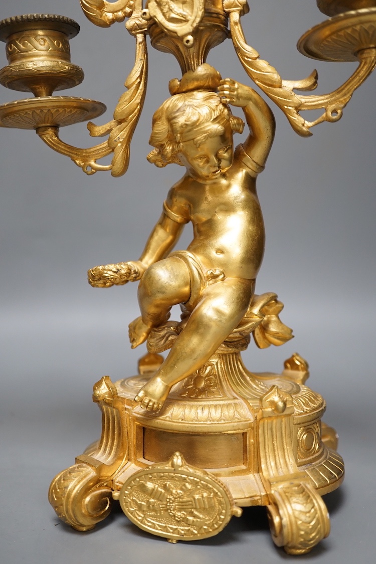 A pair of Louis XVI ormolu cherub candelabra 31cm